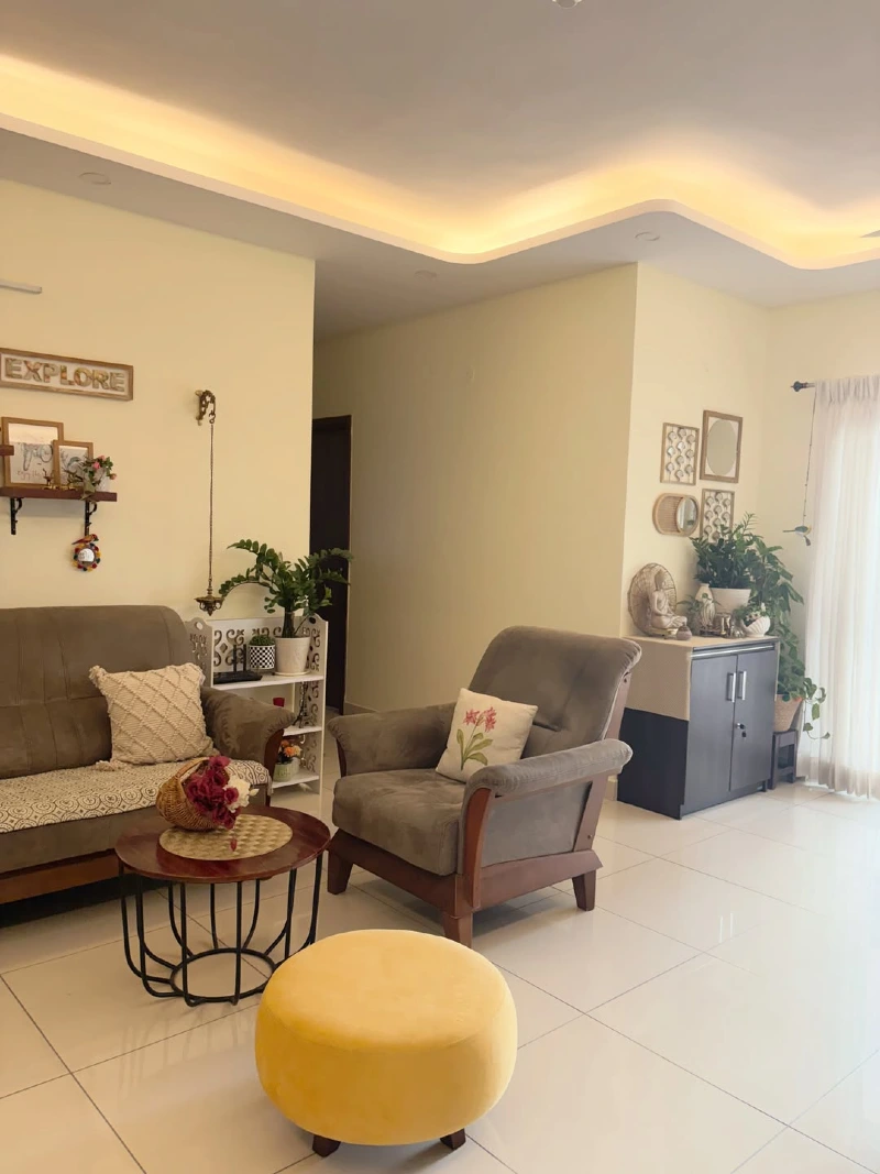 Yellow Velvet Ottoman with Brown Armchair and Wavy Recessed Ceiling Lighting