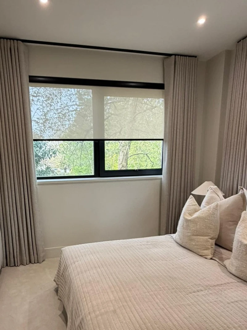 Ceiling Mounted Curtains Layered with a Bordered Roller Shade