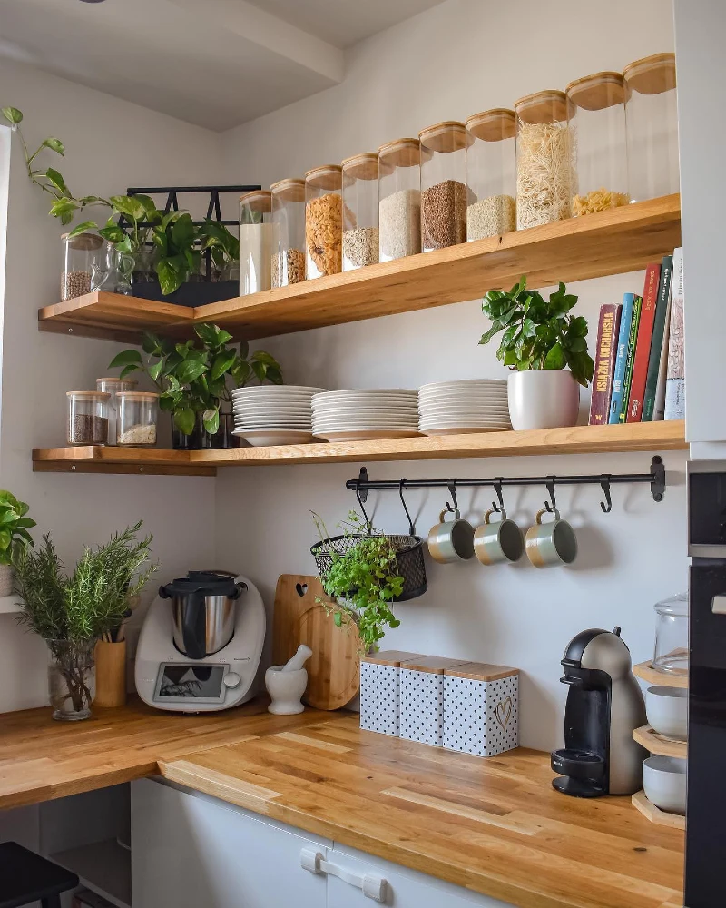 Corner Wood Shelves with Matching Pantry Jars, White Plates, and Hanging Mugs