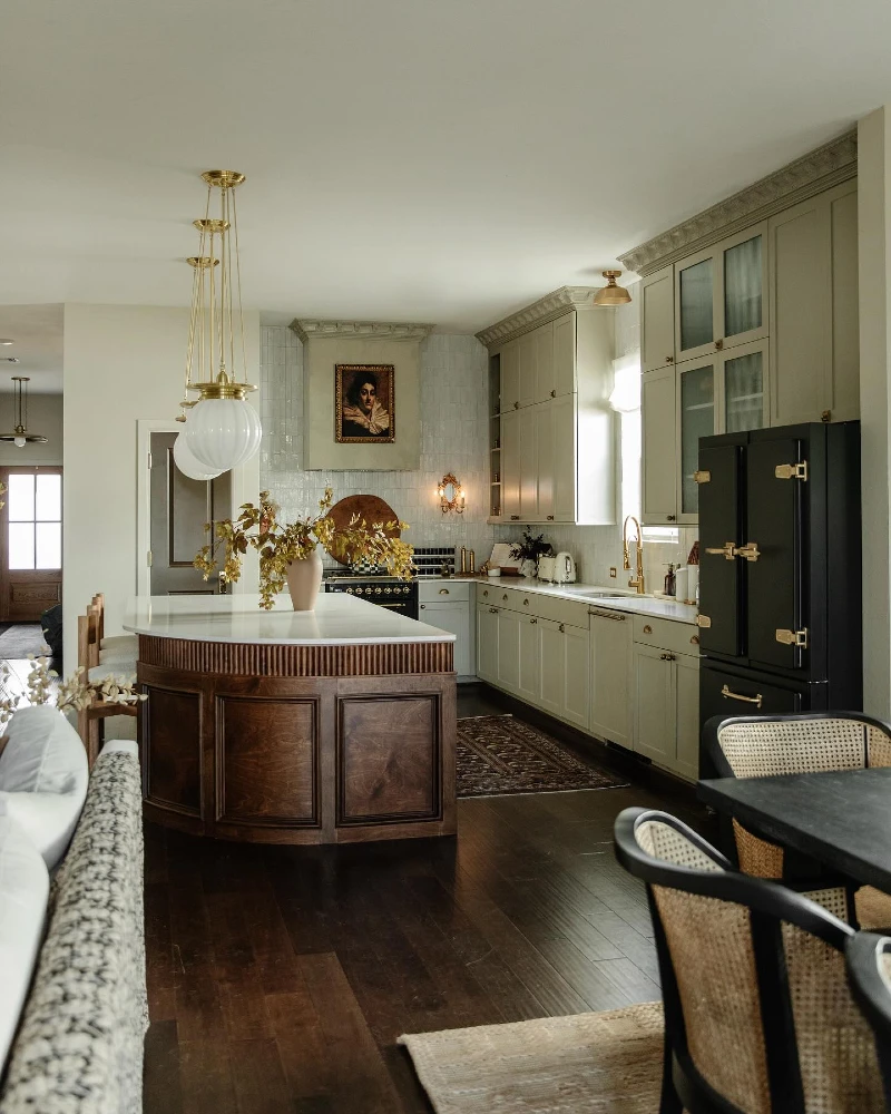 Curved Walnut Island with Reeded Trim and Pale Stone Counter