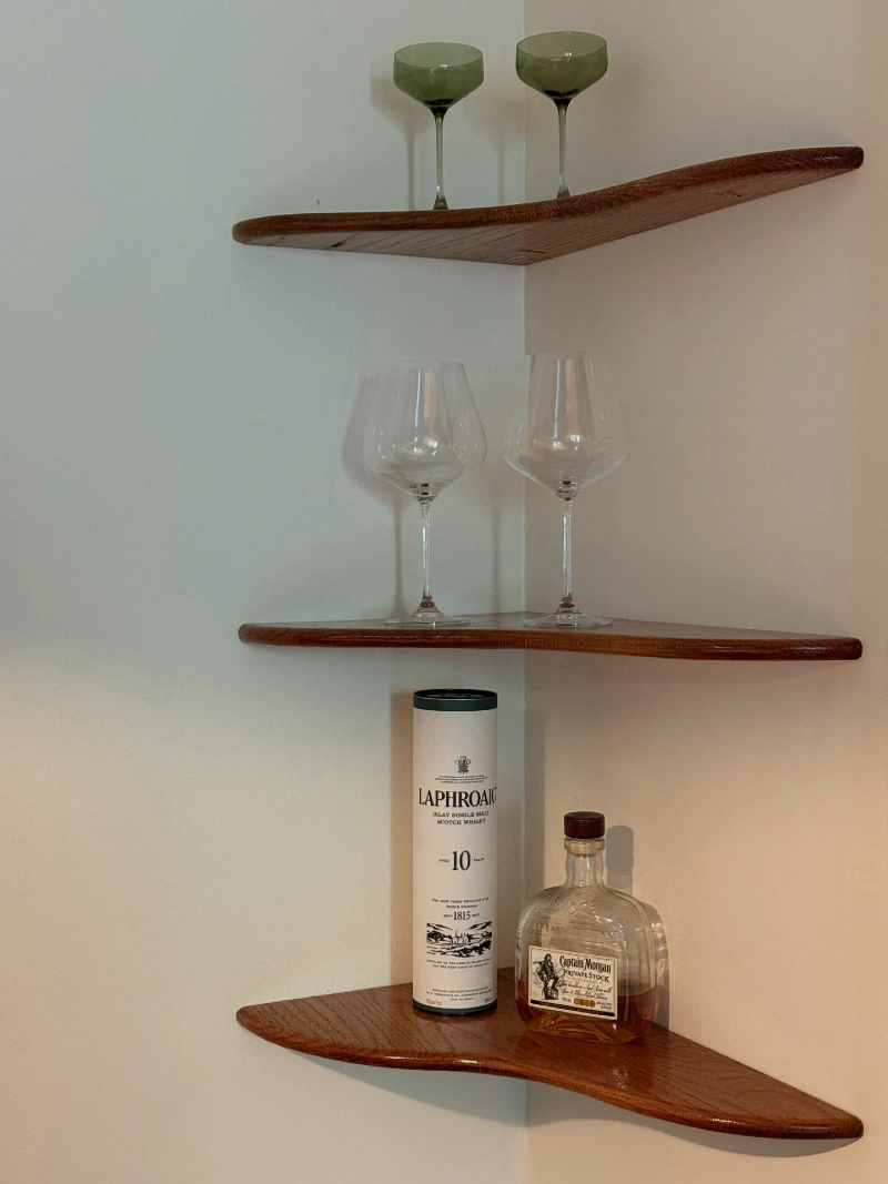 Curved Wood Corner Shelves with Glassware and Bar Bottles