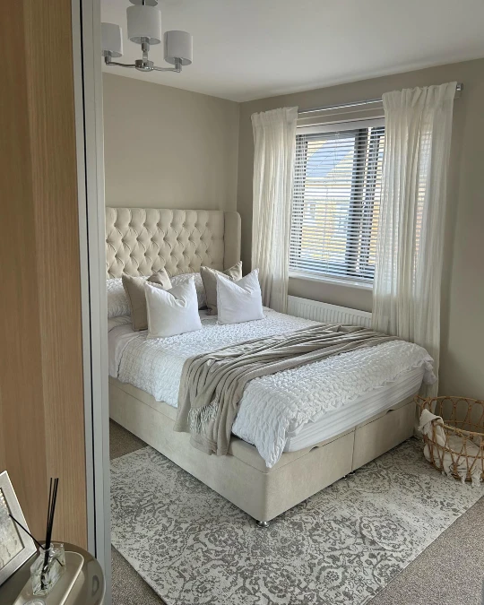 Deeply Tufted Storage Bed and Sheer Drapes