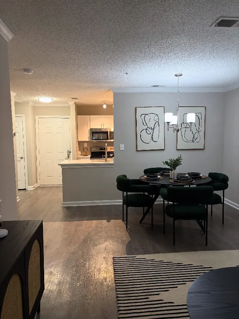 Emerald Green Dining Chairs with Abstract Line Art Pair and Nickel Chandelier