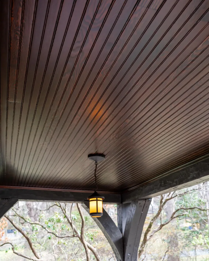 Espresso Beadboard Porch Ceiling with Amber Pendant Light