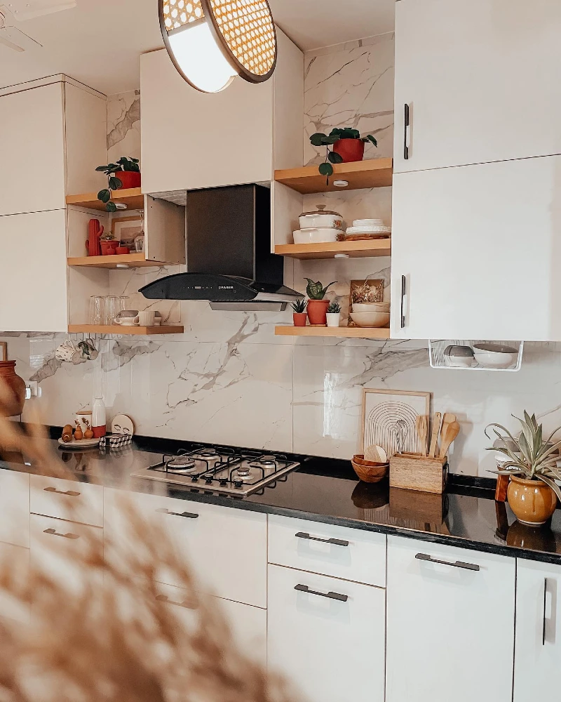 Floating Wood Shelves with White Serveware, Terracotta Pots, and Marble Backsplash