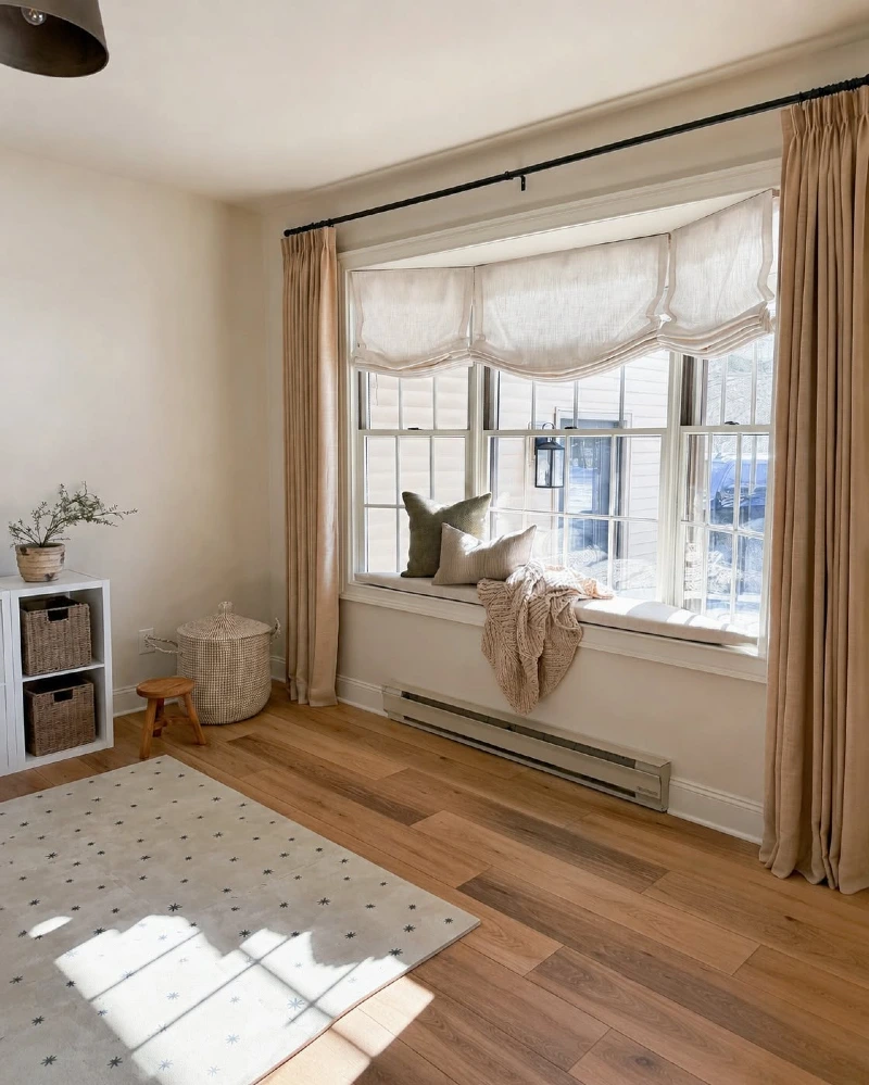 Floor Length Beige Curtains Layered Over Soft Roman Shades