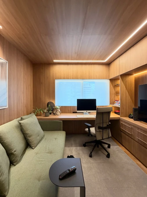 Floor to Ceiling Wood Paneling Builds a Focused Retreat