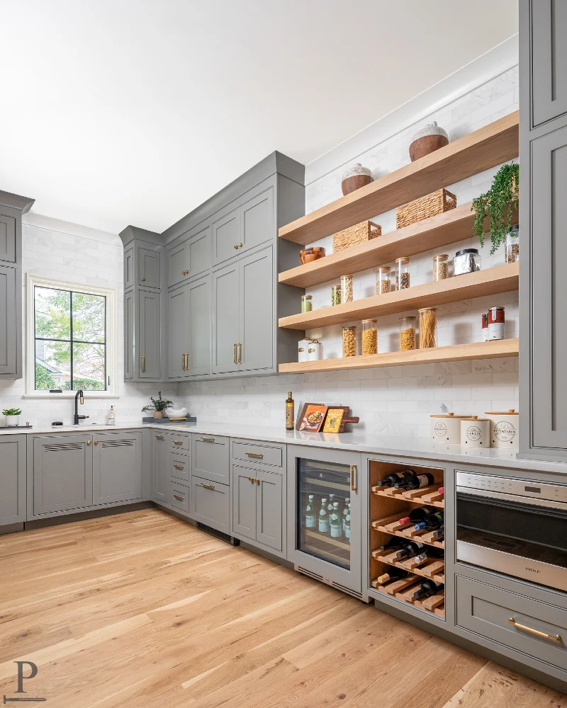 Four Oak Shelves with Glass Pantry Jars, Woven Baskets, and Trailing Greenery