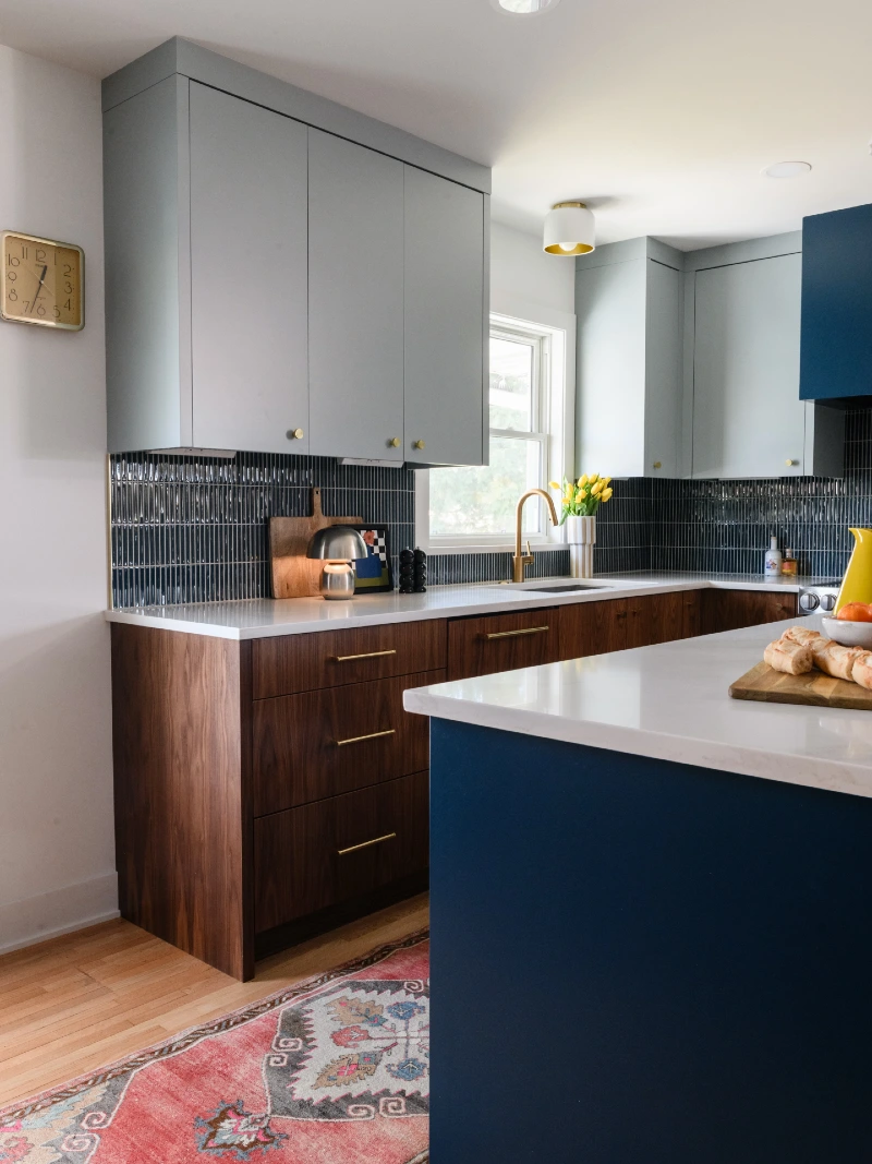 Glossy Navy Vertical Tile with Walnut Drawers and Pale Blue Cabinets