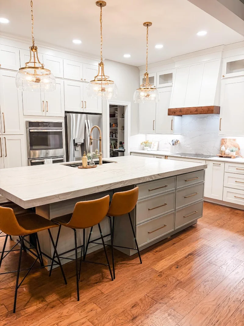 Gray Drawer Island with Corner Seating, Sink, and Leather Stools