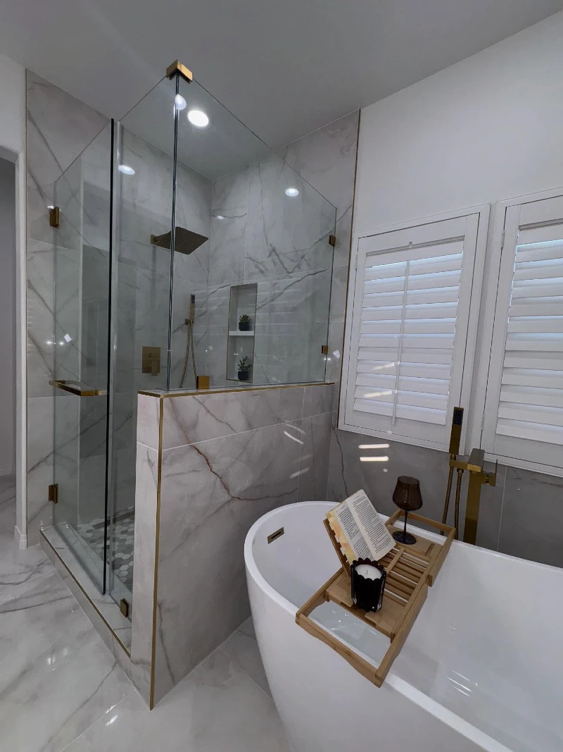Half-Wall Glass Shower with Freestanding Tub and Wooden Caddy