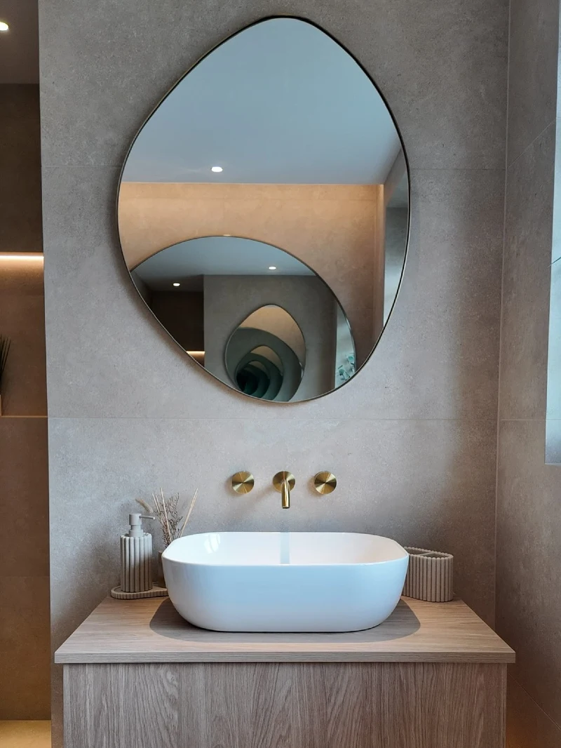 Irregular Flowing Glass Mirror with Minimalist Wall Spout