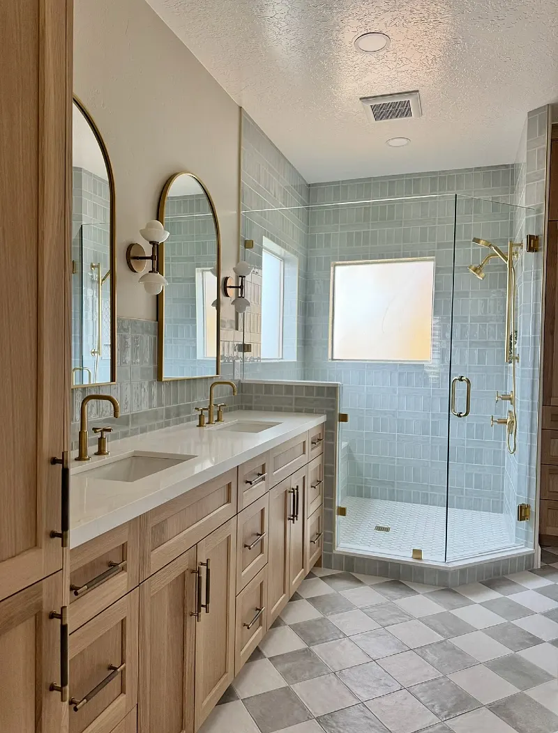 Light Oak Double Vanity with Blue Zellige Tile and Gray Checkerboard Floor
