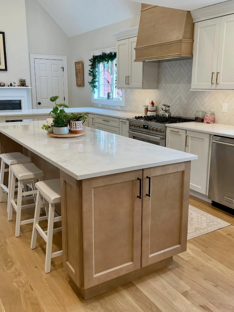 Light Wood Island with Hidden Storage and Three White Counter Stools