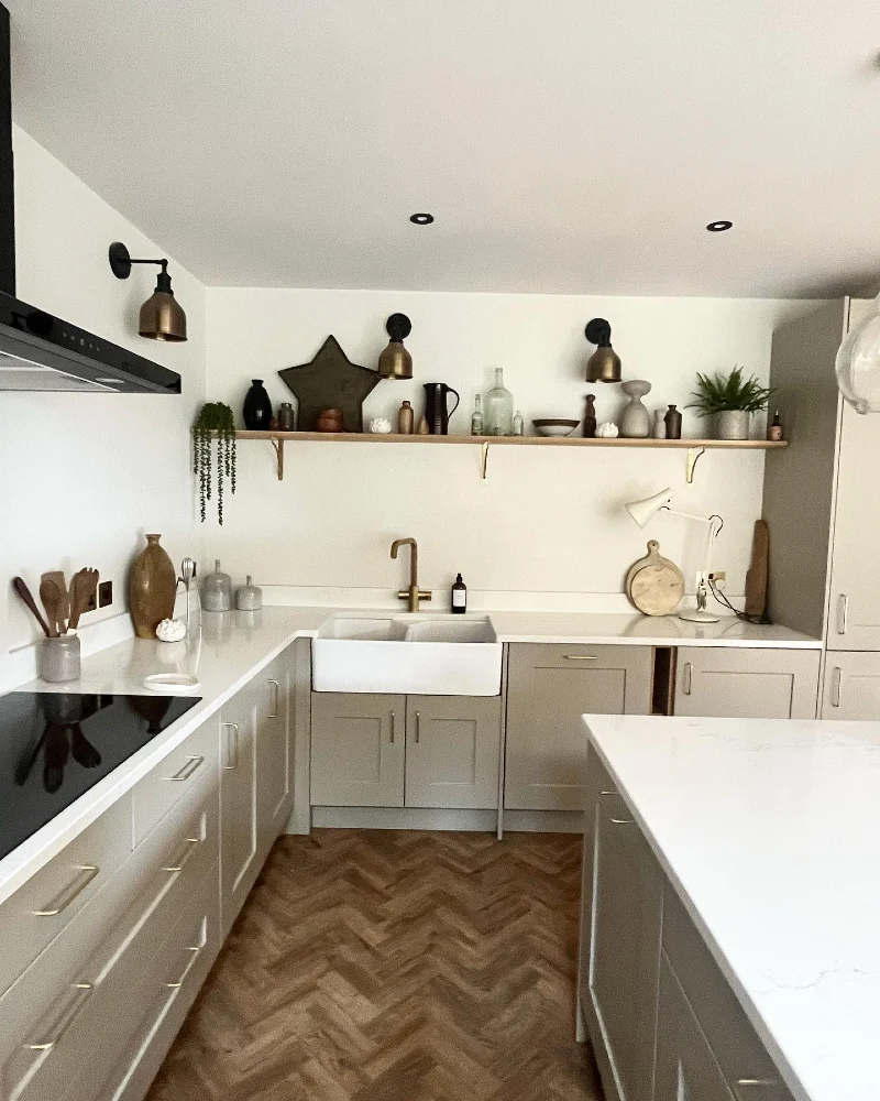 Long Wood Shelf with Earthy Pottery, Glass Bottles, and Trailing Greenery