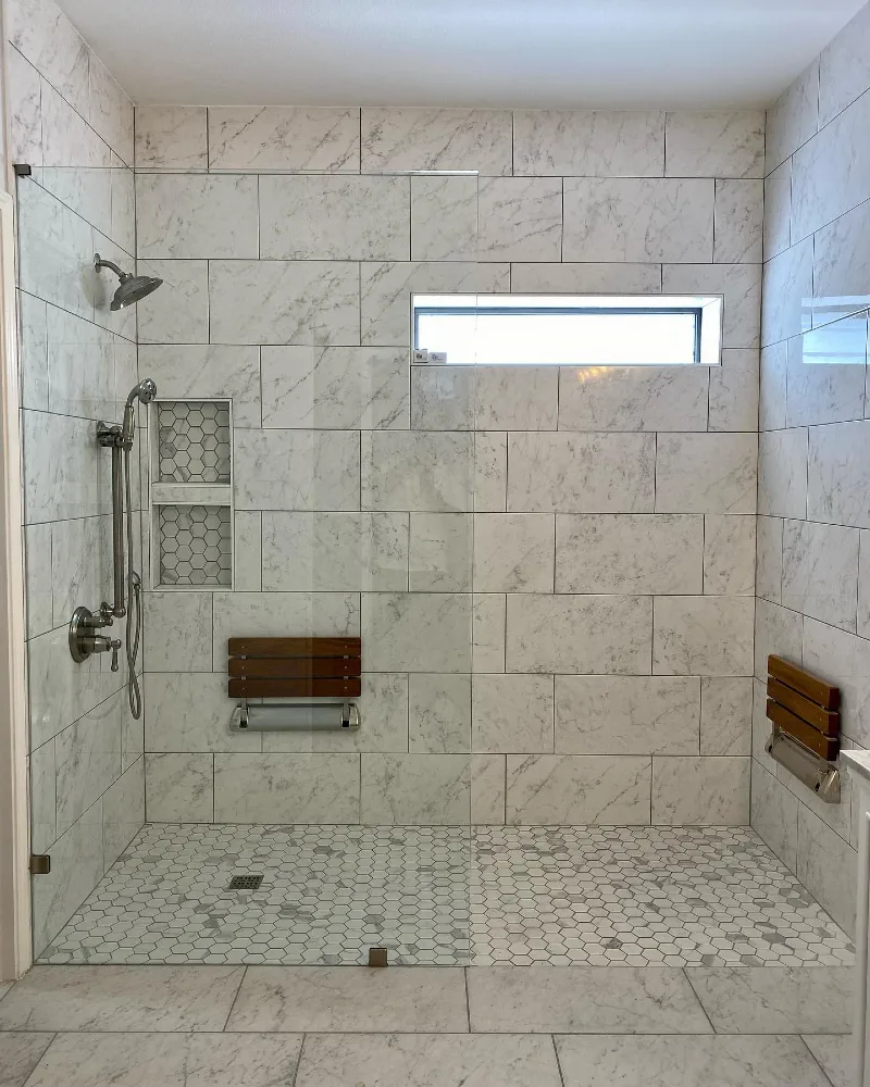 Marble Subway Tile Walk-In Shower with Dual Fold-Down Teak Seats and Hexagon Floor Tile