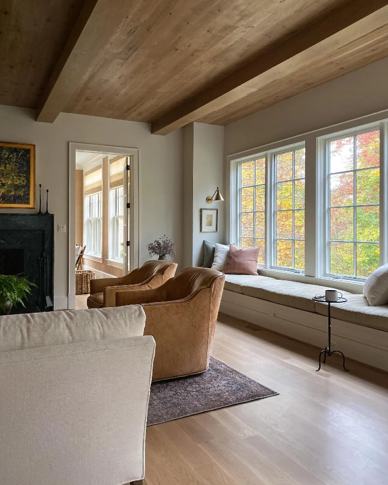 Natural Woven Roman Shades Framing the Connected Sunroom