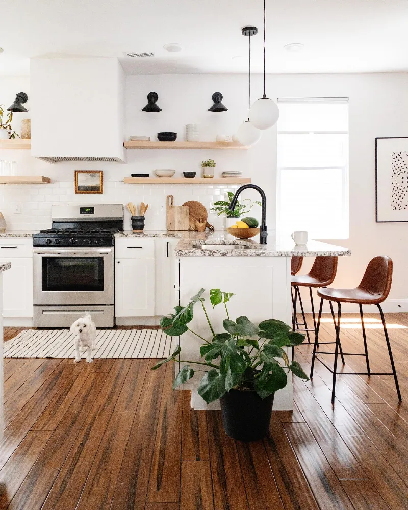 Pale Wood Kitchen Shelves with Ceramic Bowls and Black Sconces