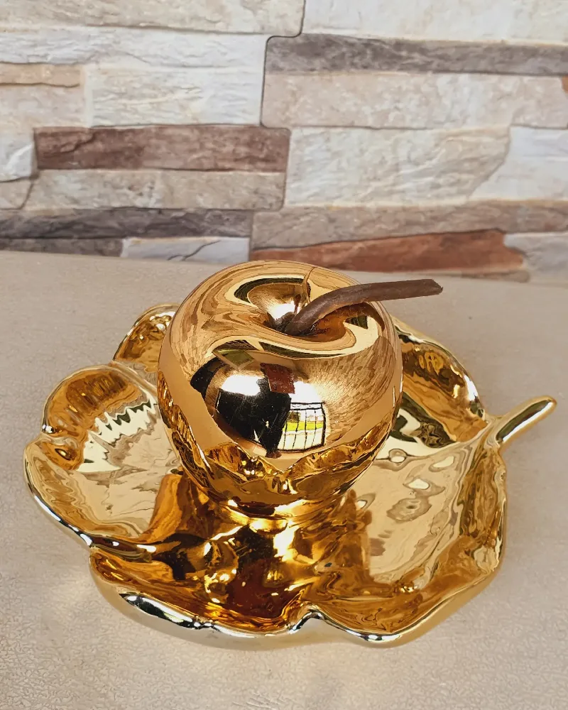 Polished Gold Ceramic Apple Figurine Resting on Matching Leaf Tray