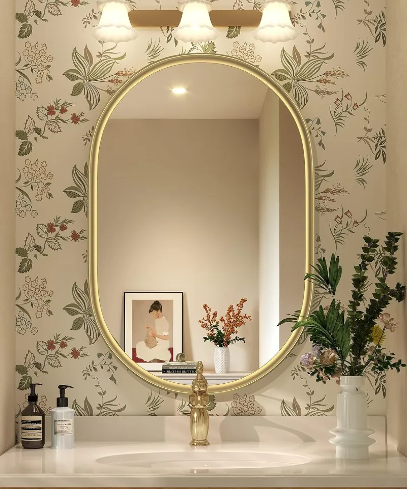 Slim Oval Brass Mirror against Botanical Floral Wallpaper