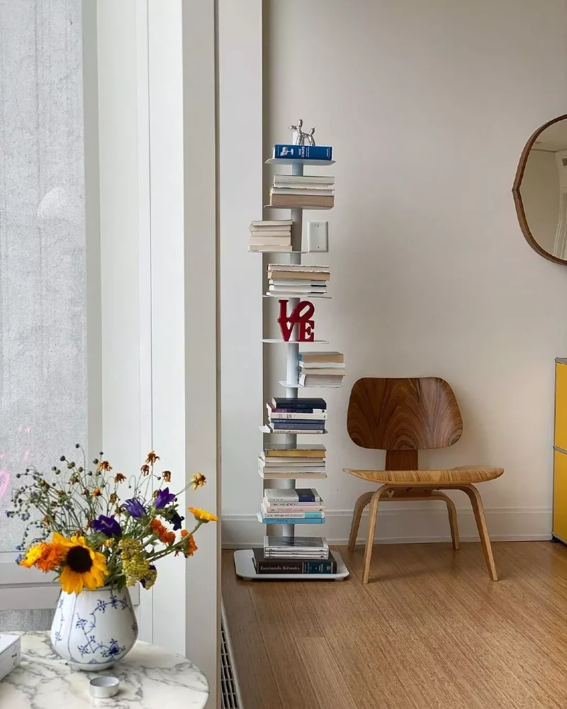 Slim Vertical Spine Tower Holding Stacked Books
