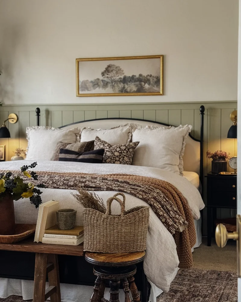 Soft White Bedding with Brown Patterned Throw and Black Accent Pillows