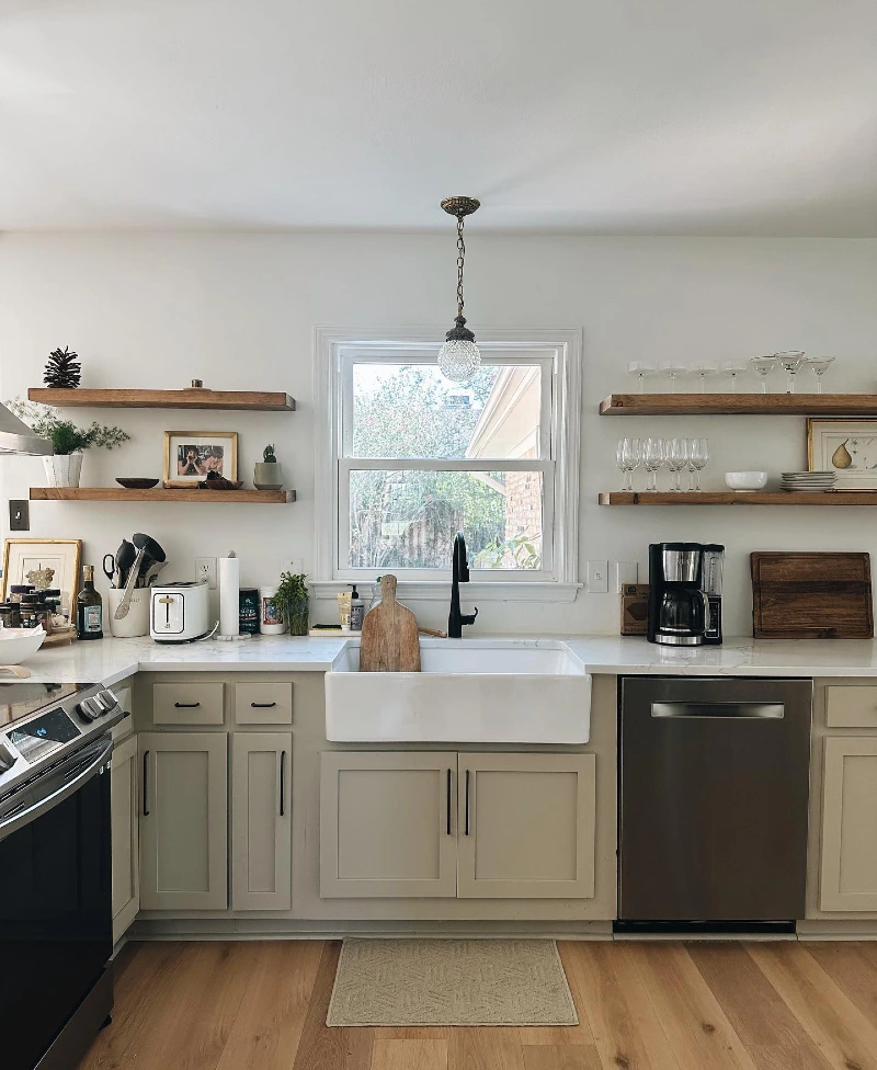Split Wood Shelves with Clear Stemware, Framed Art, and Everyday Dish Stacks