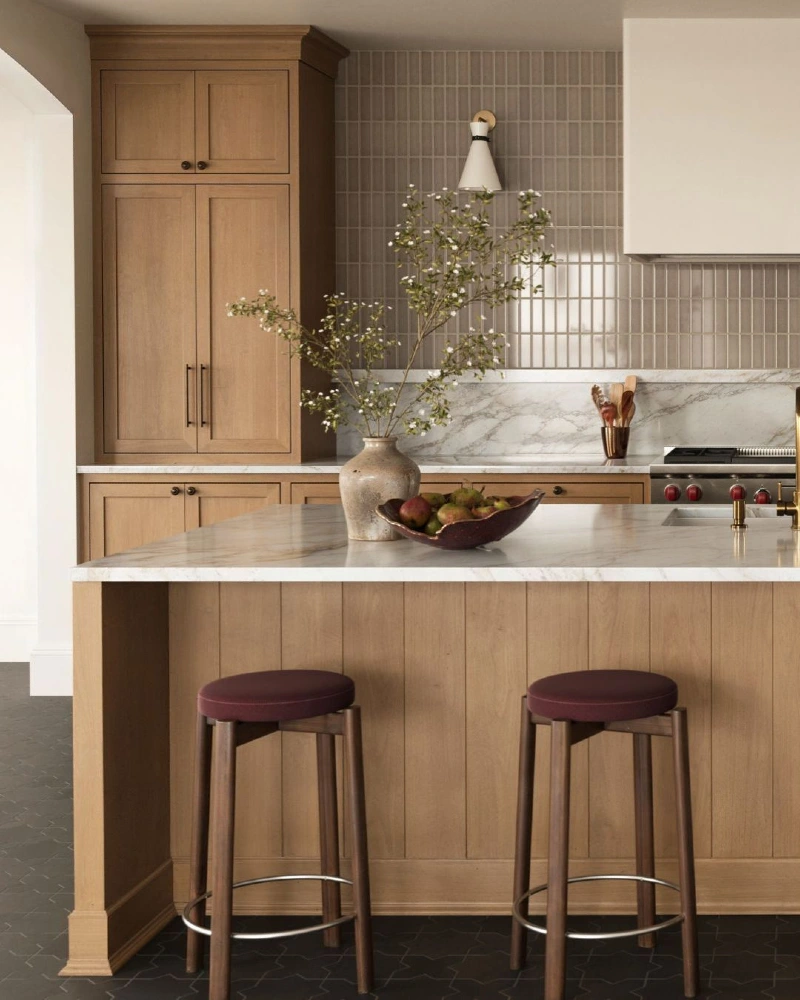 Taupe Vertical Tile Backsplash with Marble Ledge and Warm Oak Cabinetry