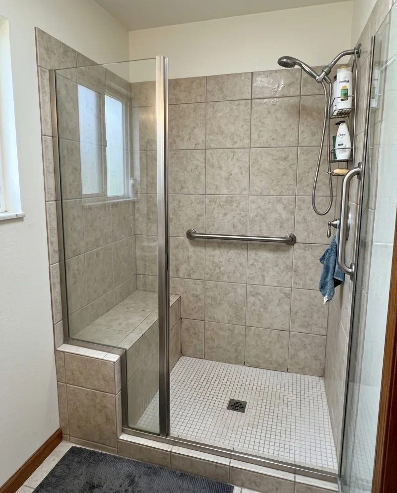 Tiled Walk-In Shower with Built-In Bench Seat and Vertical Entry Support Bar