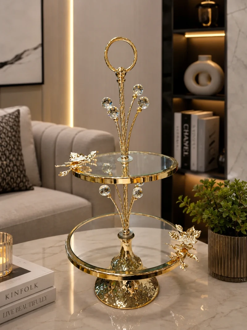 Two-Tiered Gold and Glass Serving Stand on Marble Table