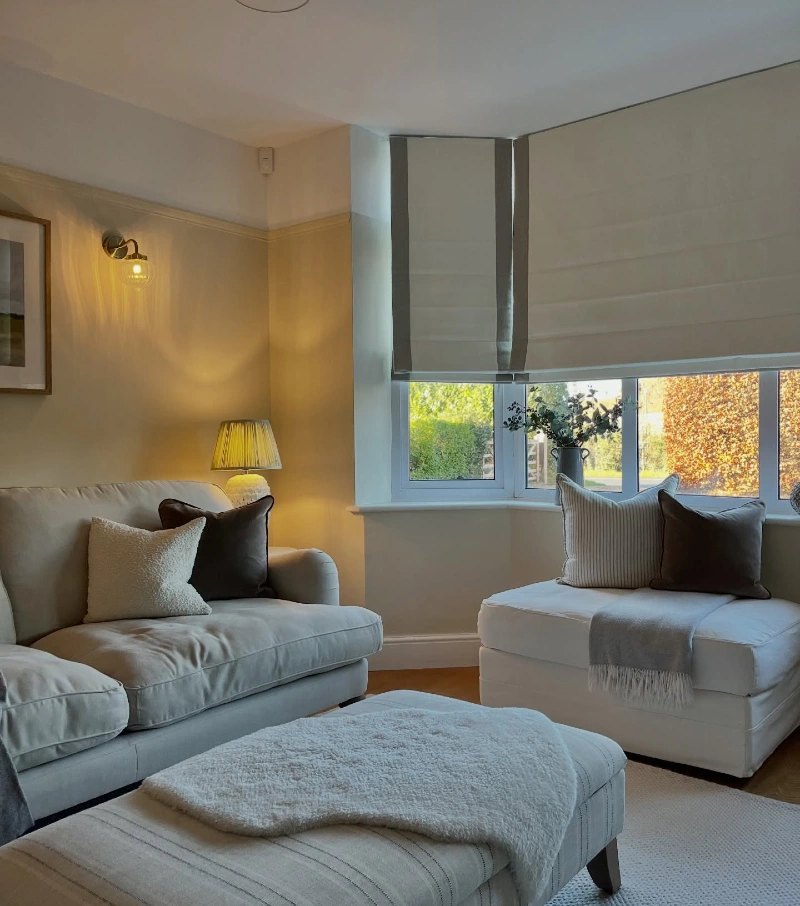 Two Tone Roman Shades Wrapped Around a Corner Window