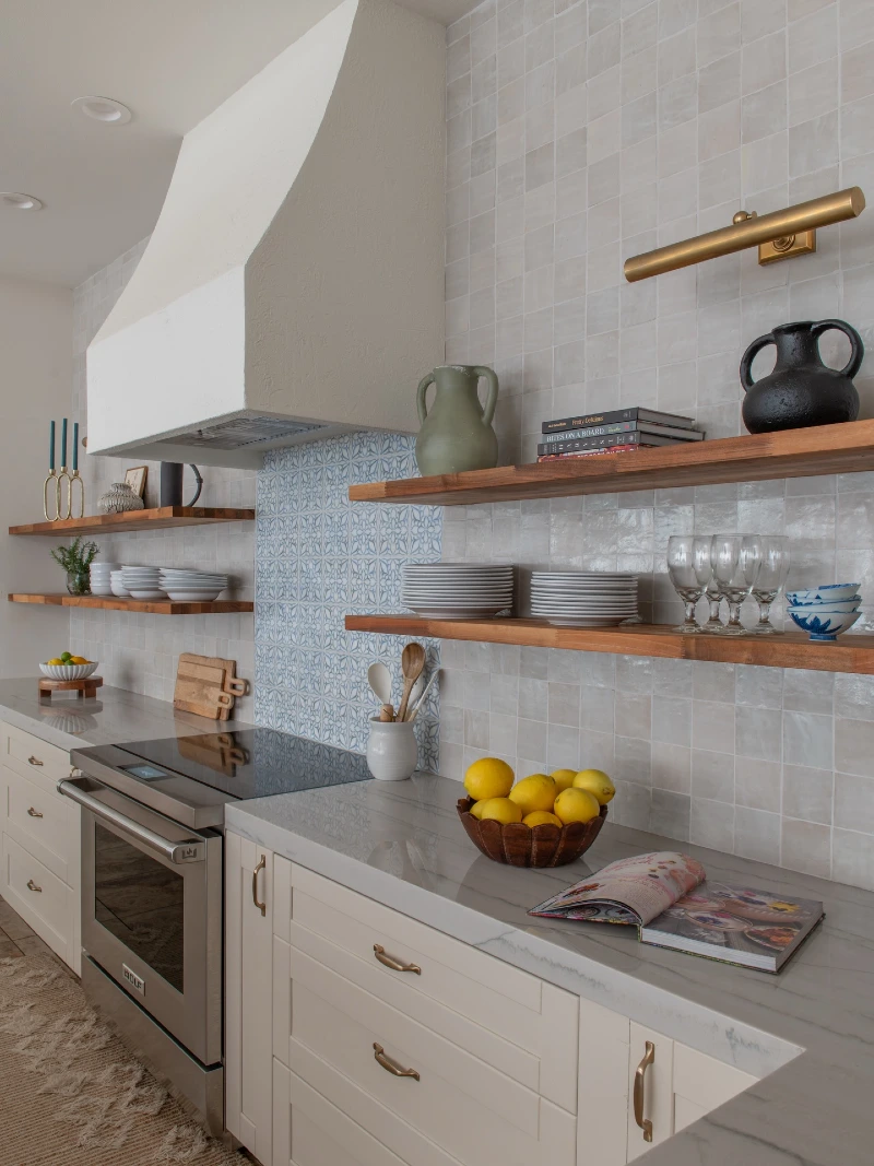 Walnut Shelves with Stacked White Plates, Blue Bowls, and Sculptural Pottery