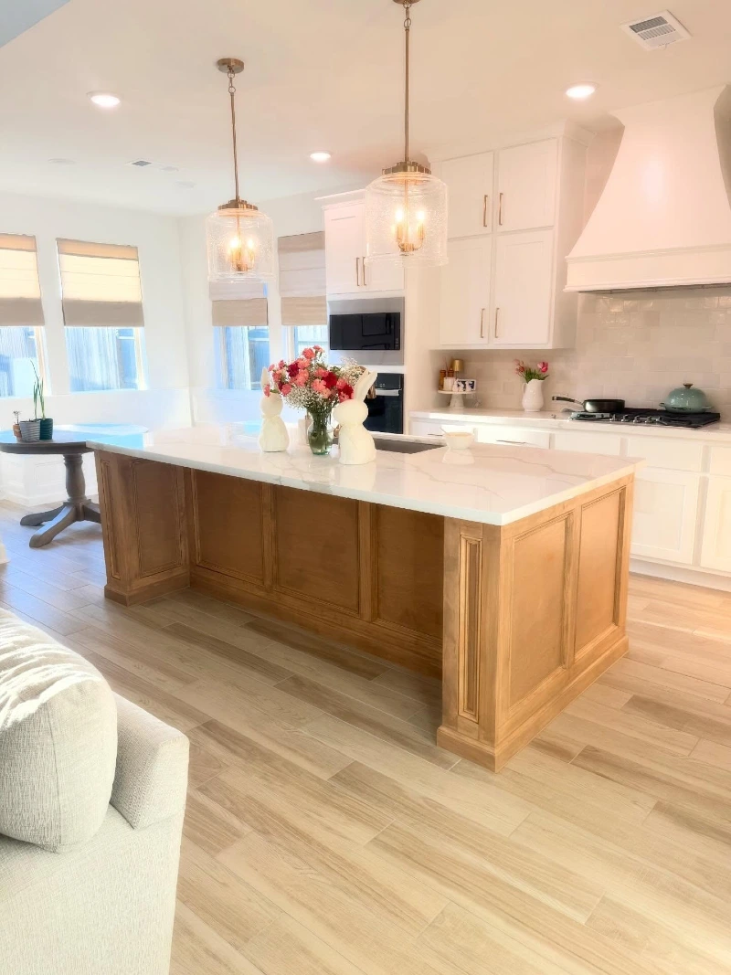 Warm Wood Island with White Stone Top and Built In Sink