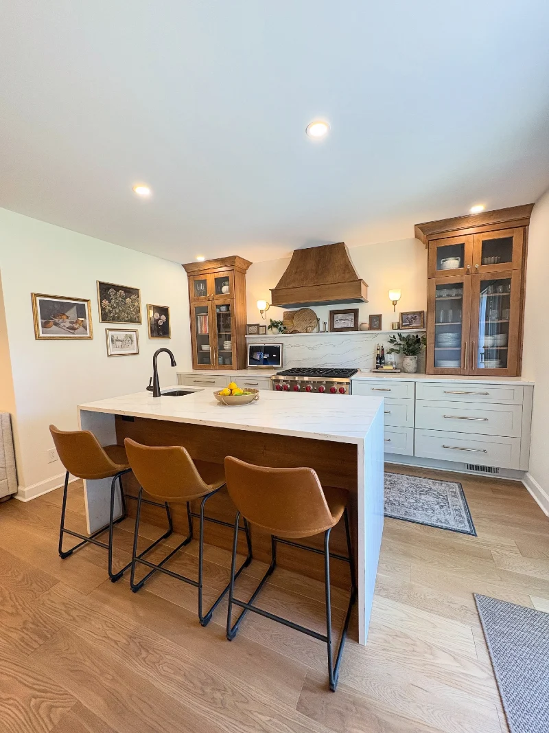  Waterfall Stone Island with Walnut Paneling and Leather Bar Stools