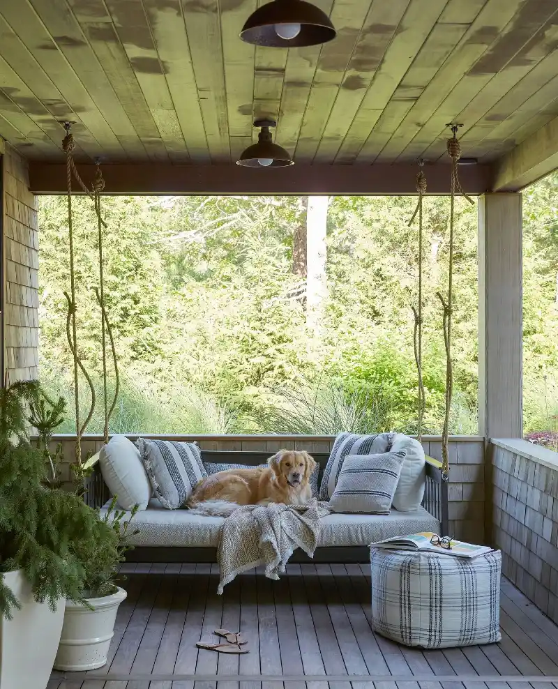 Weathered Green Wood Ceiling with Hanging Daybed and Vintage Dome Lights