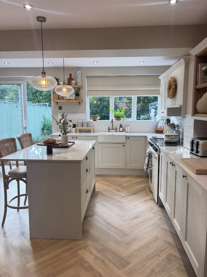 White Storage Island with Breakfast Seating and Wide Prep Counter