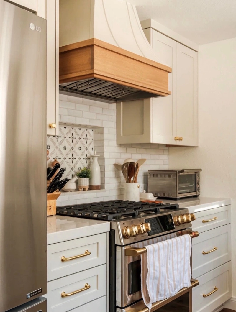White Subway Tile with Patterned Stove Niche and Wood Trim Hood